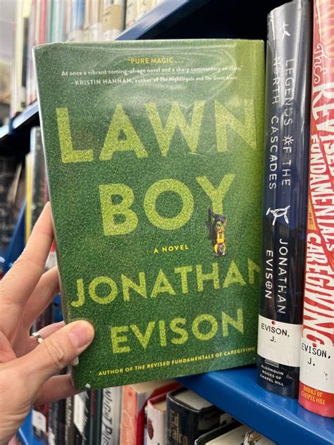 Hand Showing a Copy of the Book Lawn Boy by Jonathan Davis from the ...