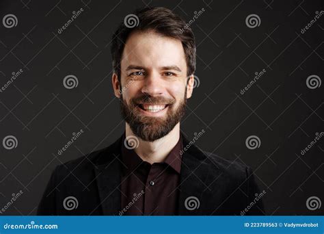 Bearded Happy Man In Black Jacket Smiling And Looking At Camera Stock