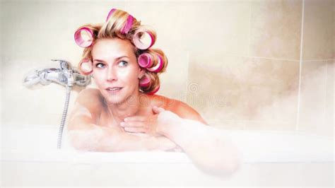 Cinemagraph Of Blond Woman With Curlers Lying In Hot Bathtub Stock Video Video Of Lady Blonde