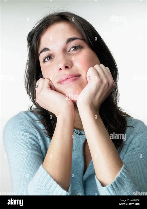 Woman Resting Head On Hands Stock Photo Alamy