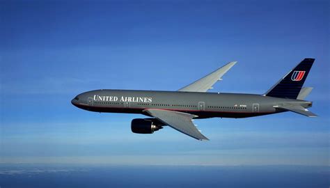 Download Ascending Black United Airlines Plane Wallpaper | Wallpapers.com