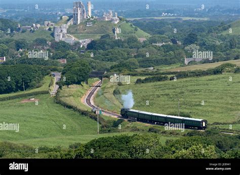 Steam Train With A Backdrop Of Corfe Castle On The Swanage Railway In