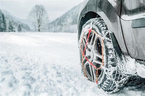 Snow chains on tire at winter snowy road 17324647 Stock Photo at Vecteezy