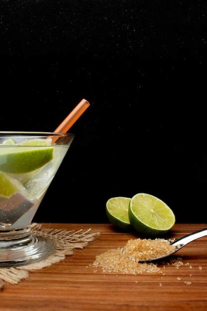 Premium Photo | Brazilian drink caipirinha with lemon and ingredients ...