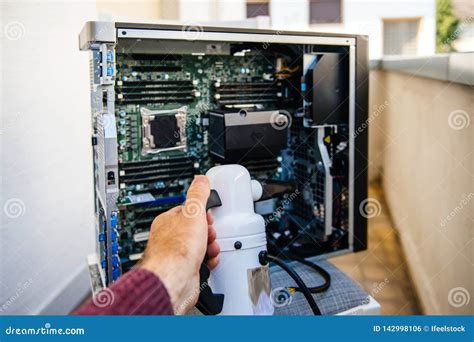 Man Preparing To Clean Computer Case with Dust Cleaner Stock Photo ...