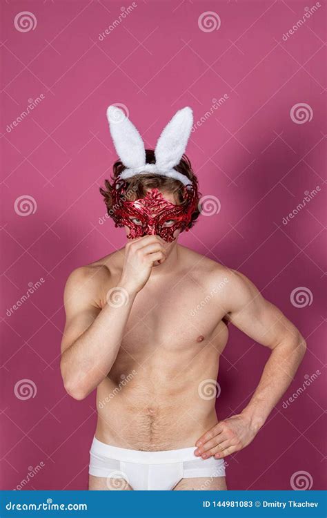 Funny Naked Guy Wearing Bunny Ears And Carnival Mask Over Pink Background Stock Image Image Of