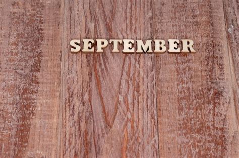 Premium Photo September Month The Name Of The Months On A Wooden