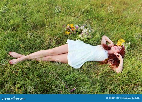 Barefoot Girl in Wreath Lies on Grass Stock Image - Image of hair ...