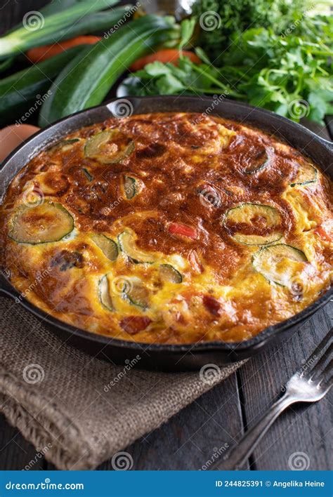 Oven Baked Frittata With Zucchini Bell Peppers Red Onions In A Cast