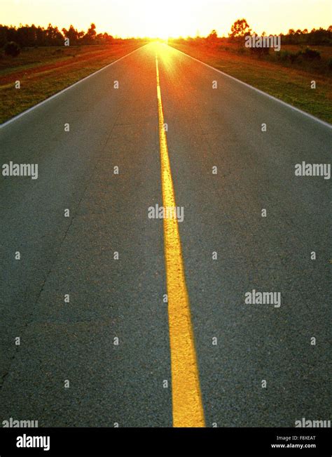 Open Road Leading into Beautiful Sunset Stock Photo - Alamy