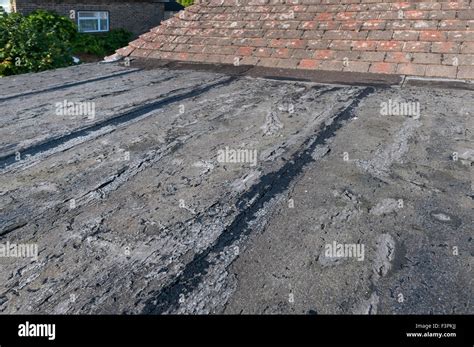 Failing And Deteriorating Flat Roof Cracked Up Opening Joint Cracks