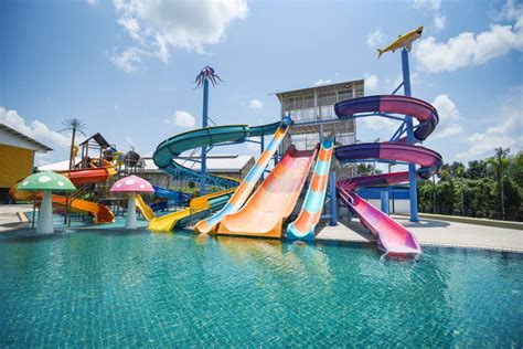 Water Park Slide with Swimming Pool at Amusement Park - Colored Plastic ...