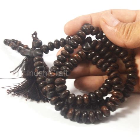 Tasbih Galih Kayu Asem Model Bulat Pipih Asli 7x10mm Cokelat Tua