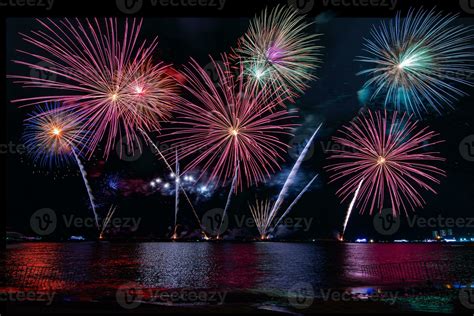 Amazing Beautiful Colorful Fireworks Display On Celebration Night Showing On The Sea Beach With