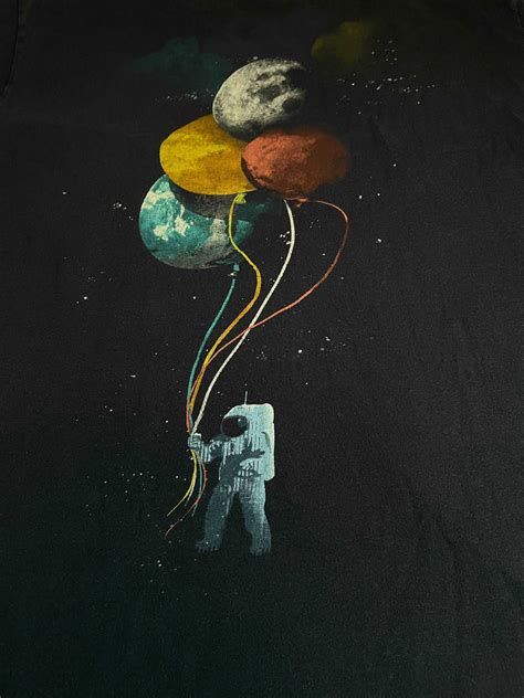 Astronaut Holding Planets Thekingkohn