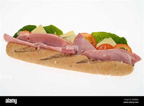 A ham and cheese salad sub sandwich -white background Stock Photo - Alamy