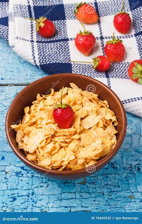 Portion Of Corn Flakes In The Bowl With Strawberries Stock Photo