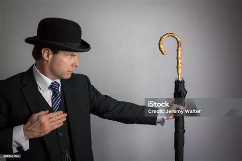 British Secret Agent Spy Hero In Fighting Pose With Umbrella Stock