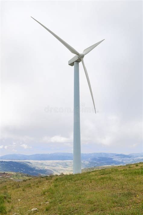 Windmills Used To Generate Energy In The Foreground With Sky And Sunny