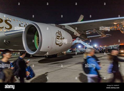 DUBAI, UAE - OCTOBER 20, 2016: Passengers leave Airbus A380 of Emirates ...