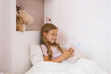 Girl in Bed Reading a Book. Have Fun in a Cozy Bedroom Stock Image ...