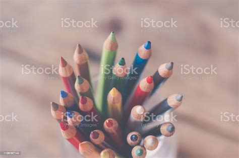 Creativity Colored Pencils In A Can On Rustic Wooden Table White