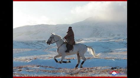 Kim Jong Un rides white horse up sacred mountain | World News | Sky News