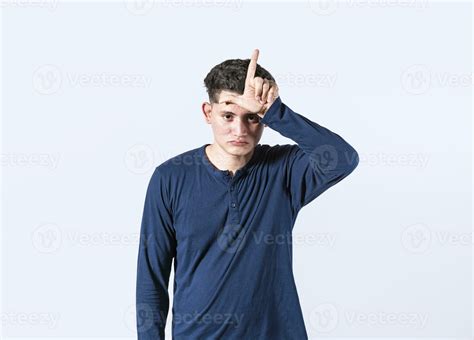 Unhappy Man Holding Hand Near Forehead Showing Loser Gesture With