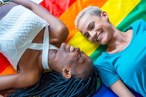 Premium Photo Beautiful Lesbian Couple Over Rainbow Flag Lgbt Concept Romantic Pose Smiling