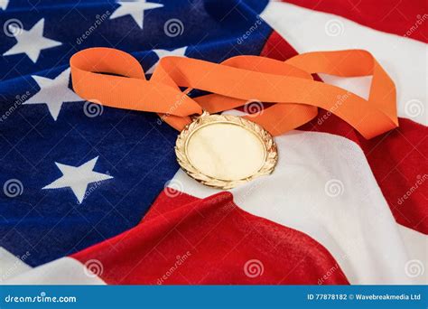 Close Up Of Gold Medal On American Flag Stock Photo Image Of