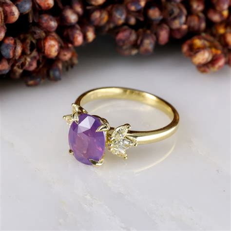 18ct yellow gold Winged purple sapphire and yellow diamond ring ...