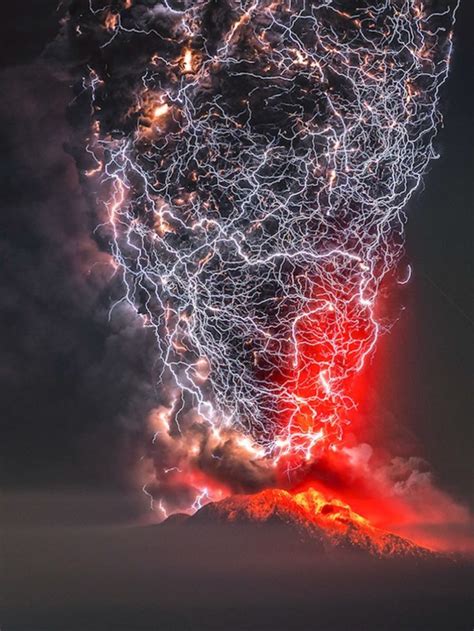 A Volcano Erupts Lava As Lightning Strikes Through The Sky In This