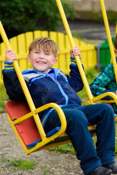 Two Boys On A Swing Stock Image Image Of Young Grass 11644867