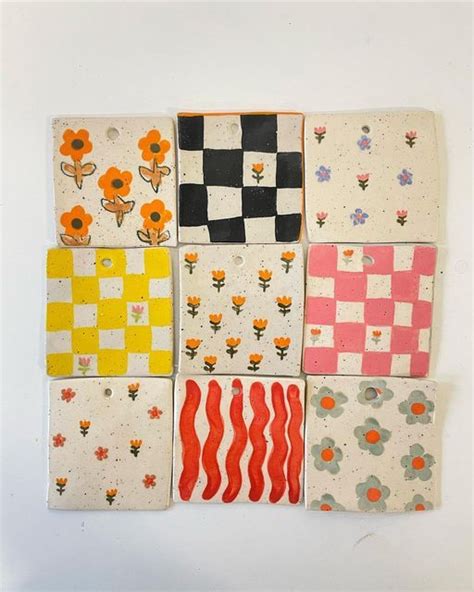 Six Squares With Flowers And Checkered Designs Are Arranged On A White