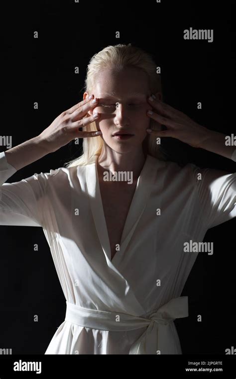 Young Blonde Albino Woman Doing Face Building Facial Gymnastics Self