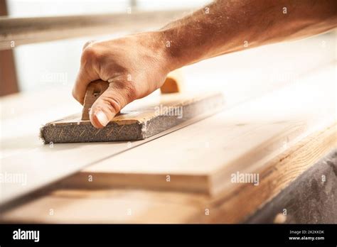 Carpenter Using Sander In Workshop To Smooth Wood Stock Photo Alamy