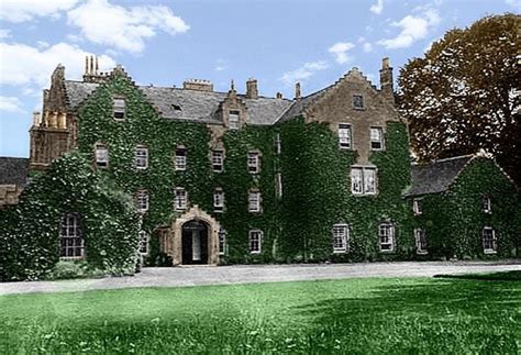 An Old Building With Ivy Growing All Over It