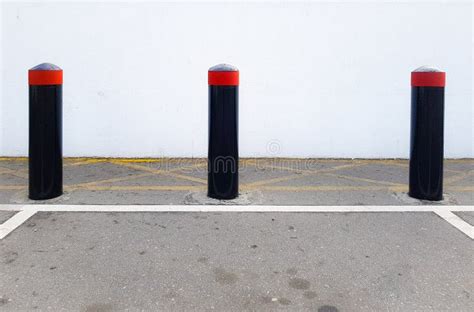 Concrete Security Bollards Vehicle Crash Barriers In A Parking Lot