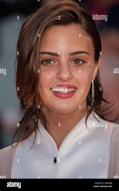 Luana Giuliani Poses For Photographers Upon Arrival At The Premiere Of