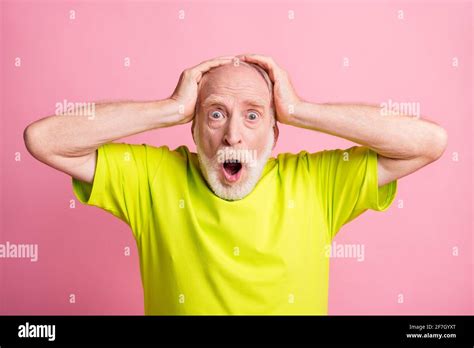 Photo Of Impressed Person Open Mouth Staring Speechless Arms On Head Wear Lime Isolated On Pink