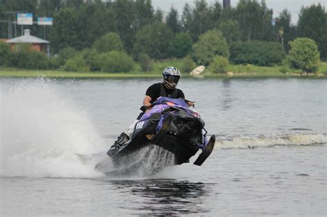 LENS and COVER - PHOTOGRAPHY: Snowmobiling on water