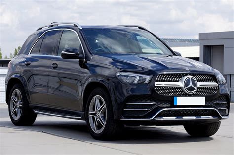 parked black mercedes benz  stock photo
