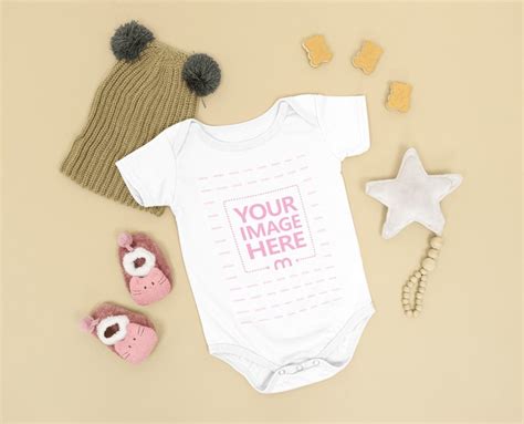 Baby Onesie Mockup Laid Over a Brown Background - Mediamodifier