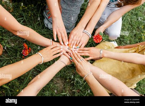 Female Models Joining Hands In A Circle Teamwork Stock Photo Alamy