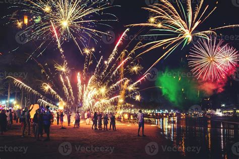 Fireworks with silhouettes of people in a holiday events.New Year ...