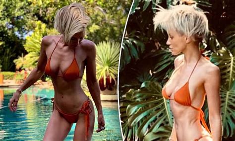 Nicky Whelan Shows Off Her Incredible Figure In A Skimpy Orange Bikini