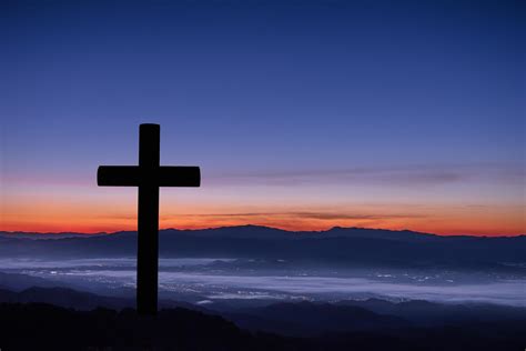 Silhouette of cross on mountain sunrise background. 7778081 Stock Photo at Vecteezy