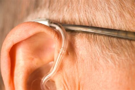 Premium Photo Close Up Of Man Wearing Hearing Aid