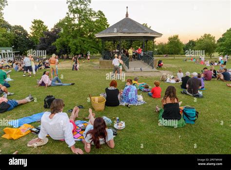 People Listening To Live Music At The Parliament Hill Bandstand In