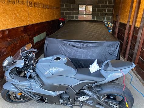 My first Kawi, ZX-10R and my 18 ZL1 parked for winter storage. Both ...